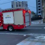 霧島市消防局　中央消防署　PA マイクパフォーマンスで警戒しながら交差点進入。　ホワイトシャッタープロジェクト
